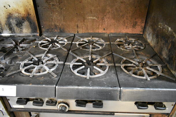 Garland Metal Commercial Natural Gas Powered 6 Burner Range w/ Oven, Over Shelf and Back Splash. This Unit Was In Working Condition When the Restaurant Closed. (kitchen) - Image 5 of 6