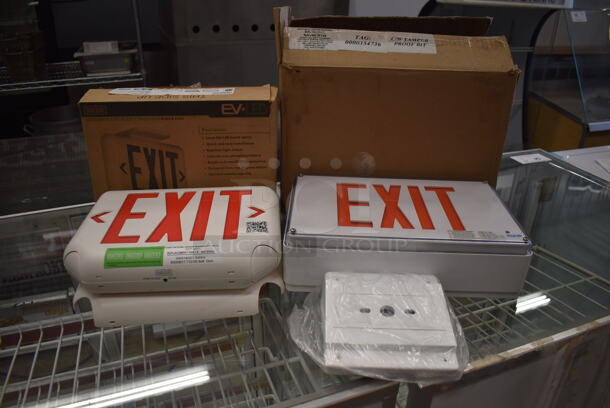 2 Exit Signs. Includes 12x9x3. 2 Times Your Bid!
