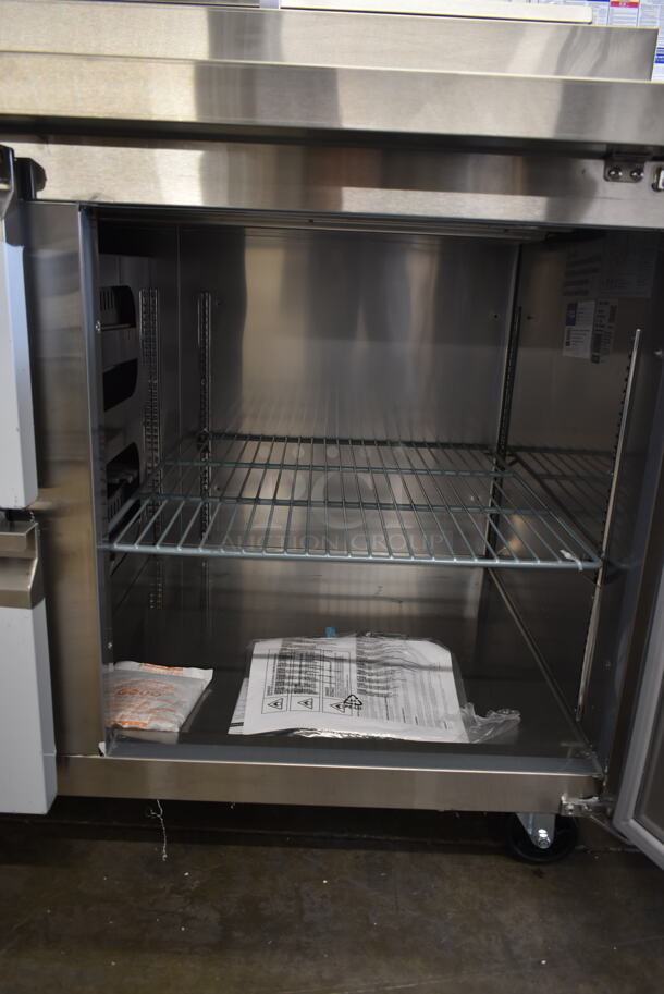 BRAND NEW SCRATCH AND DENT! 2023 Avantco 178SSPPT3 Stainless Steel Commercial Pizza Prep Table w/ 2 Doors and 2 Drawers on Commercial Casters. 115 Volts, 1 Phase. Tested and Working! - Image 8 of 9