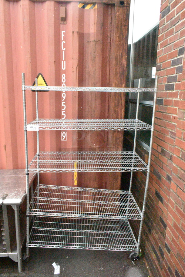 Chrome Finish 5 Tier Wire Shelving Unit on Commercial Casters. BUYER MUST DISMANTLE. PCI CANNOT DISMANTLE FOR SHIPPING. PLEASE CONSIDER FREIGHT CHARGES. - Image 1 of 3