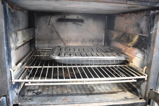 Wolf 2PS-2 Stainless Steel Commercial Natural Gas Powered 4 Burner Range w/ Oven on Commercial Casters.  - Image 5 of 7