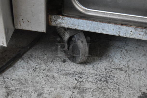 Stainless Steel Commercial Single Door Work Top Cooler w/ Backsplash on Commercial Casters. Tested and Powers On But Does Not Get Cold - Image 8 of 10