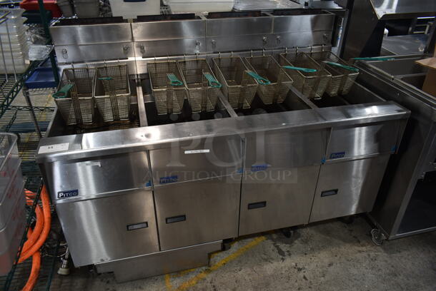 2017 Pitco Frialator SG14-S Stainless Steel Commercial Natural Gas Powered 4 Bay Deep Fat Fryer w/ 8 Metal Fry Baskets on Commercial Casters. 110,000 BTU. 