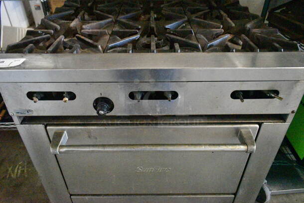 Garland SunFire Stainless Steel Commercial Natural Gas Powered 6 Burner Range w/ Oven, Back Splash and Contents on Commercial Casters.  - Image 3 of 7