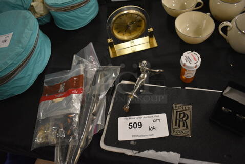 ALL ONE MONEY! Lot of Rolls Royce Items Including Clock, License Plate Cover, Cuff Links, Windshield Wiper Blades, Spirit of Ecstasy Emblem, Flash Light, Aprons, Car Parts and Mini Fuses