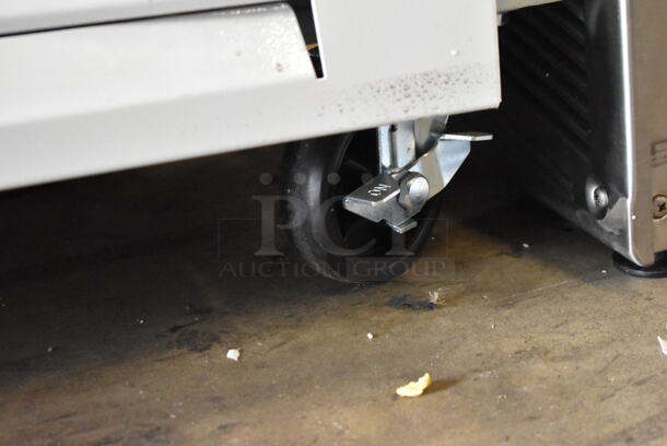 BRAND NEW SCRATCH AND DENT! 2023 Avantco 178GDS33HCW Metal Commercial 2 Door Reach In Cooler Merchandiser w/ Poly Coated Racks on Commercial Casters. 115 Volts, 1 Phase. Cannot Test Due To Cut Power Cord - Image 5 of 9