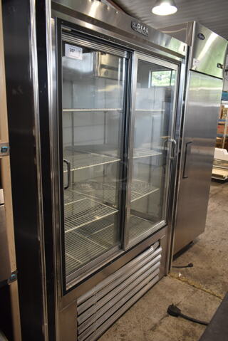Dial Stainless Steel Commercial 2 Door Reach In Cooler Merchandiser. 115 Volts, 1 Phase. Tested and Powers On But Does Not Get Cold
