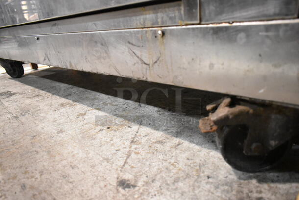 Rotisol 1350.8 Stainless Steel Commercial Floor Style Natural Gas Powered Rotisserie Oven on Commercial Casters.  - Image 3 of 8