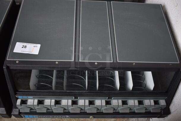 Snack-Mart Black Countertop 9 Slot Snack Vending Machine. 28x21x20.5 - Image 1 of 3