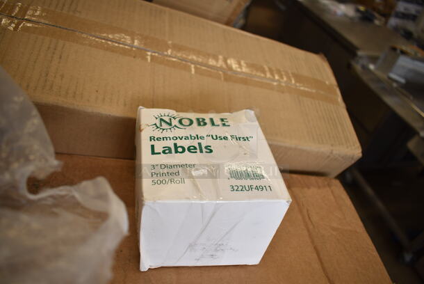 PALLET LOT of 34 BRAND NEW Boxes Including 105GC36321 Choice 1 Part Green and White Guest Check with Bottom Guest Receipt - 50/Case, 176WDBASE Acopa Wood Stand for Glass Beverage Dispensers, 2 Box 394365L Noble Large Gloves, 3 Box 128HD16COMBO ChoiceHD 16 oz. Microwavable Translucent Plastic Deli Container and Lid Combo Pack - 240/Case, 500TW7 Choice 7 oz. Translucent Thin Wall Plastic Cold Cup - 2500/Case, 760PCC03W Choice 3 oz. White Poly Paper Cold Cup - 5000/Case, 2 Box 500MFT Lavex White M-Fold (Multifold) Towel - 4000/Case, 177KNIFESHRP Galaxy KNIFESHRP 2-Stage Standard-Duty Electric Knife Sharpener, 127CH24 Choice 24 oz. Clear RPET Hinged Deli Container - 200/Case, 500CC10 Choice 10 oz. Clear PET Plastic Cold Cup - 1000/Case, 322UF4911 Noble Products 3" Use First Removable Round Label with Dispenser Carton - 500/Roll, 129MCS38B Choice 38 oz. Black Rectangular Microwavable Heavy Weight Container with Lid 8 3/4" x 6 1/4" x 2" - 150/Case, 347RPBD9WHSV Visions 9" White Plastic Plate with Silver Bands - 120/Case, 394345XL Noble NexGen Powder-Free Disposable Black Hybrid 3 Mil Thick Gloves - 1000/Case. 34 Times Your Bid!  - Image 9 of 12