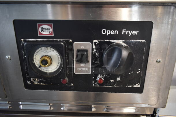 Henny Penny CG-303 Stainless Steel Commercial Floor Style  Natural Gas Powered 3 Bay Deep Fat Fryer w/ 3 Lids and 4 Metal Fry Baskets on Commercial Casters. 240,000 BTU. - Image 3 of 10