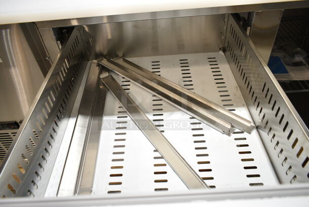 BRAND NEW SCRATCH AND DENT! 2024 Avantco 178SSPPT2 Stainless Steel Commercial Prep Table w/ Over Sized Cutting Board and 2 Drawers. Missing Door. 115 Volts, 1 Phase. Tested and Powers On But Does Not Get Cold  - Image 7 of 8