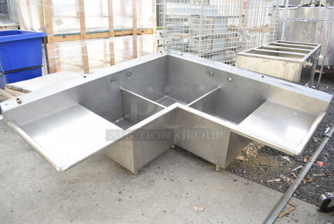 Stainless Steel Commercial L Shaped 3 Bay Sink w/ Dual Drain Board. No Legs. Bays 26x26x13, 18.5x21x13. Drain Boards 19.5x26