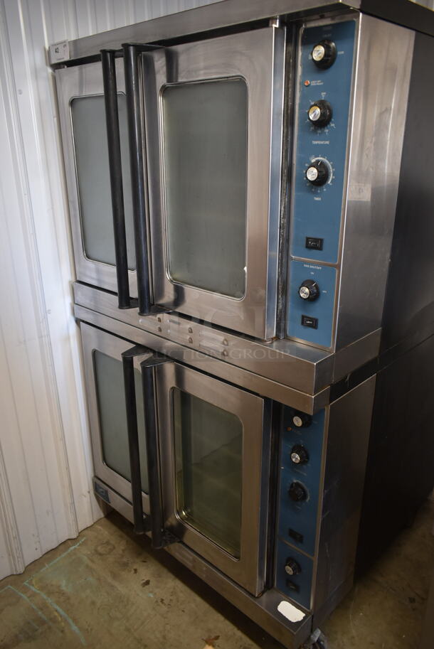2 Duke Stainless Steel Commercial Natural Gas Powered Full Size Convection Oven w/ View Through Doors, Metal Oven Racks and Thermostatic Controls on Commercial Casters. 2 Times Your Bid!