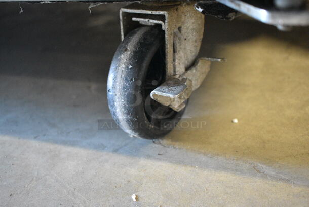 BRAND NEW SCRATCH AND DENT! 2023 Avantco 178SSUD3R Stainless Steel 3 Door Undercounter Cooler on Commercial Casters. 115 Volts, 1 Phase. Tested and Does Not Power On - Image 7 of 8