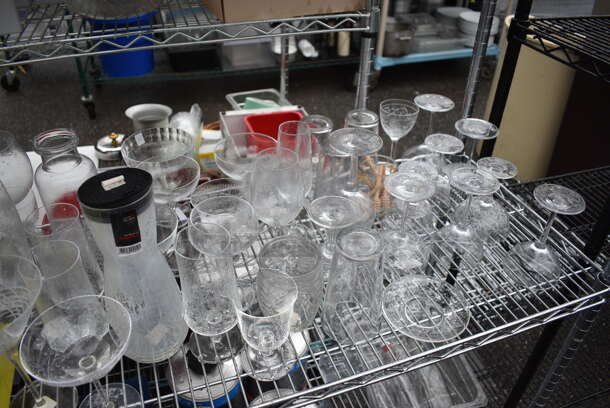 ALL ONE MONEY! Lot of Chrome Finish 4 Tier Shelving Unit on Commercial Casters w/ All Contents Including Glassware, Ceramic Plates, Metal Ice Bucket. DISMANTLE FOR SHIPPING. PLEASE CONSIDER FREIGHT CHARGES. 60x18x79 - Image 4 of 8