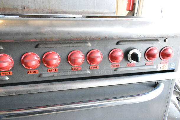 Vulcan E60 Stainless Steel Commercial Electric Powered 10 Burner Hot Plate Range w/ 2 Ovens, Over Shelf and Back Splash. 240 Volts, 1 Phase.  - Image 6 of 8