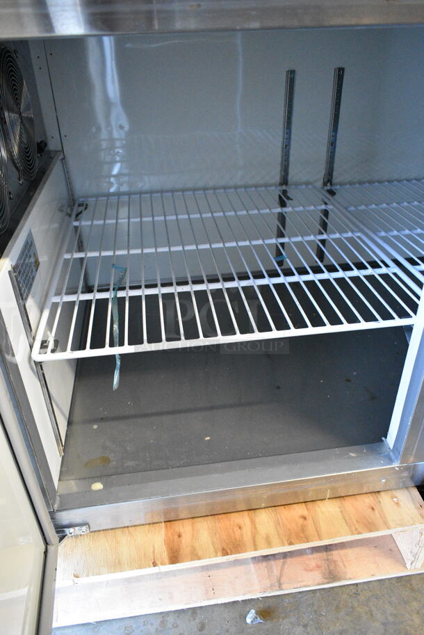 BRAND NEW SCRATCH AND DENT! 2024 Avantco 178APPT91HC Stainless Steel Commercial 3 Door Refrigerated Pizza Prep Table. 115 Volts, 1 Phase. Tested and Working! - Image 5 of 9