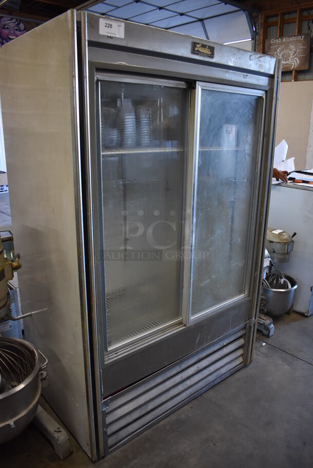 Leader Metal Commercial 2 Door Reach In Cooler Merchandiser w/ Poly Coated Racks. 115 Volts, 1 Phase. 48x31x74.5. Tested and Powers On But Temps at 51 Degrees