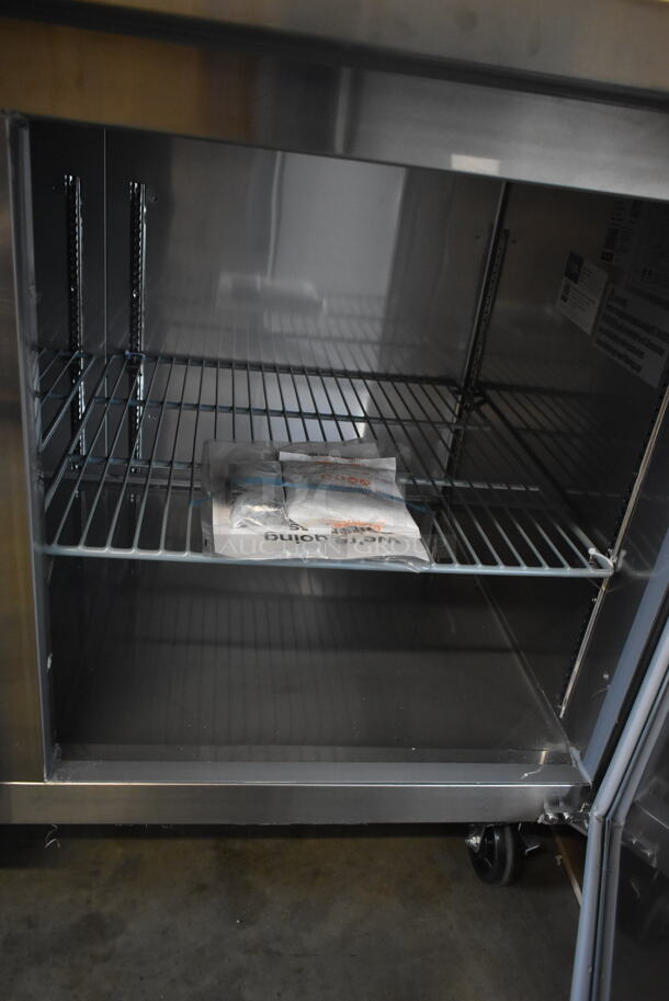 BRAND NEW SCRATCH AND DENT! 2023 Avantco 178SSPPT3 Stainless Steel Commercial Refrigerated Pizza Prep Table on Commercial Casters. 115 Volts, 1 Phase. Tested and Working! - Image 11 of 12