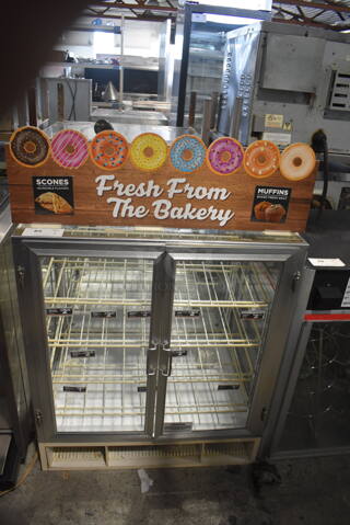 Dry Bakery Display Case With Glass Front, Sides And Back And Double Doors With Polycoated Racks.