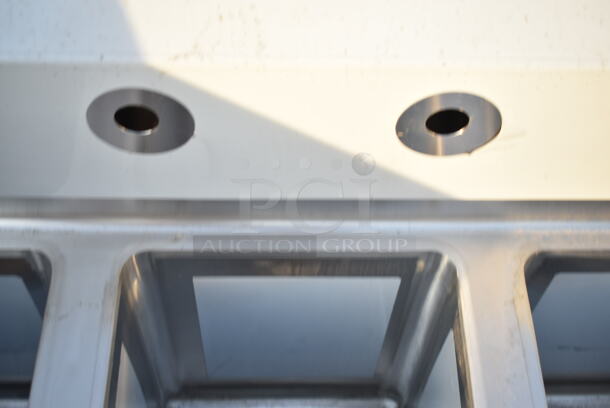 BRAND NEW SCRATCH AND DENT! Regency 600S31014 39" 16-Gauge Stainless Steel Three Compartment Commercial Sink with Galvanized Steel Legs and without Drainboards - 10" x 14" x 12" Bowls. Missing 1 Leg.  - Image 8 of 9