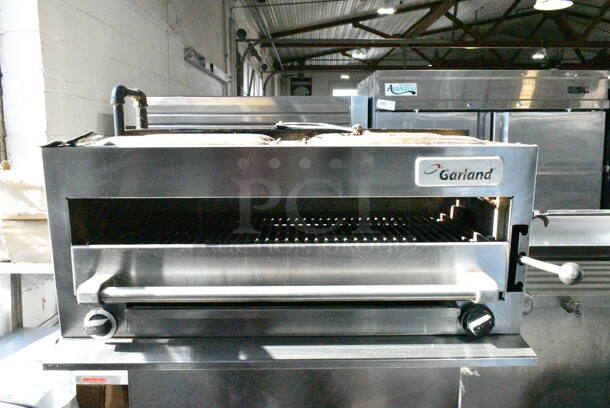 Garland M44T Stainless Steel Commercial Natural Gas Powered Flat Top w/ Oven, Salamander Cheese Melter and Back Splash on Commercial Casters. - Image 3 of 12