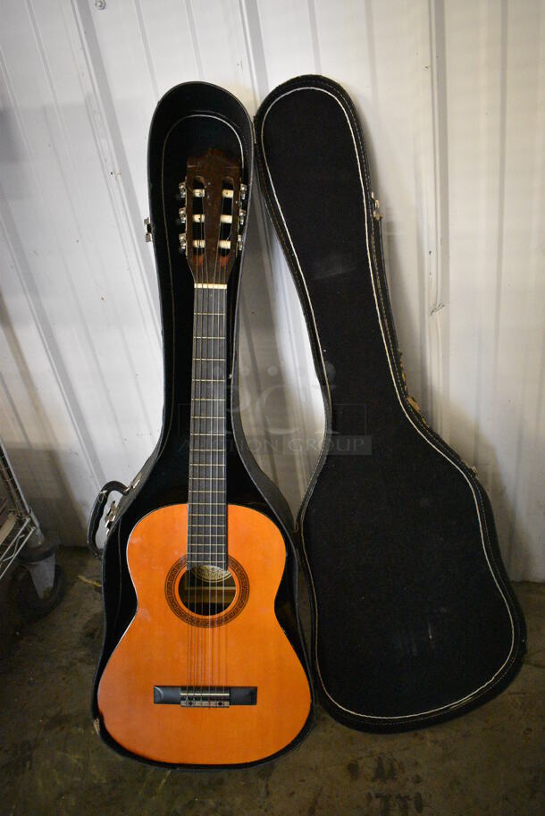 Hondo Model H311 Wood Pattern Guitar in Black Hard Case. 13x5x38
