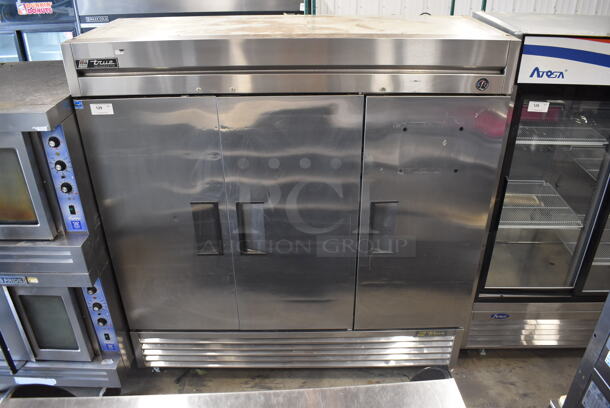 2010 True T-72 Commercial Stainless Steel Three Solid Door Reach In Cooler With Polycoated Shelves. 115V, 1 Phase. Tested and Working!