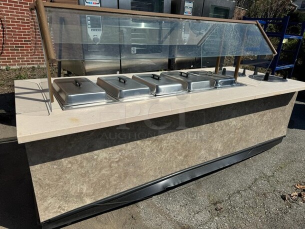 9FT 5 WELLS HOT BUFFET TABLE WITH SNEEZE GUARD AND (2) PLATE HOLDER ON CASTERS 110X46X34 SOLD AS IS! - Image 1 of 6