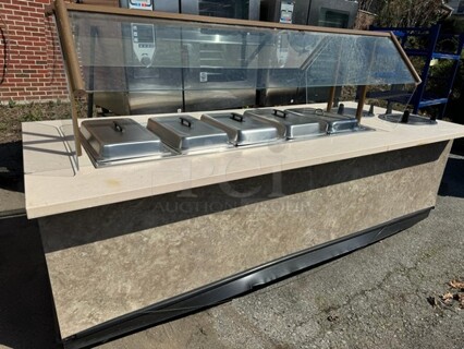9FT 5 WELLS HOT BUFFET TABLE WITH SNEEZE GUARD AND (2) PLATE HOLDER ON CASTERS 110X46X34 SOLD AS IS!
