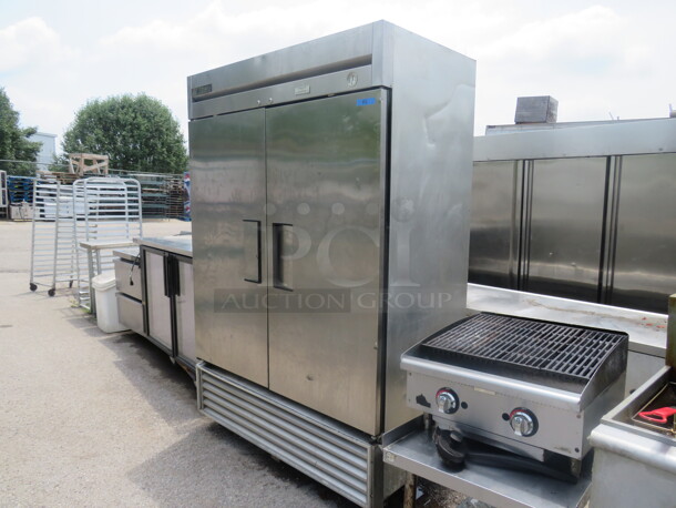 One Stainless True  2 Door Freezer With 5 Racks On Casters. Model# T-49F. 115 Volt. 54X30X82.5. $6697.60. - Image 1 of 3