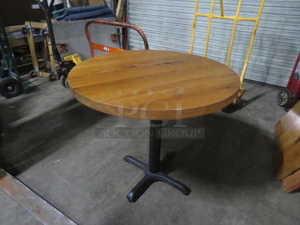 One 2 Inch Thick Solid Wooden Round  Table Top On A Pedestal Base. 36X36X30 - Image 1 of 3