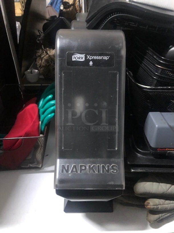 One Tork Napkin Dispenser.
