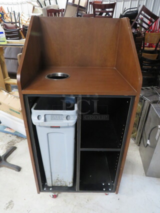 One Brown Laminate Trash Receptacle With An Overshelf, Under Storage With 1 Shelf, A Slim Jim Trash Can On Casters. 26X23X55