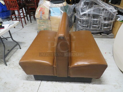 One Double Sided Brown Cushioned Booth. 44X49X35