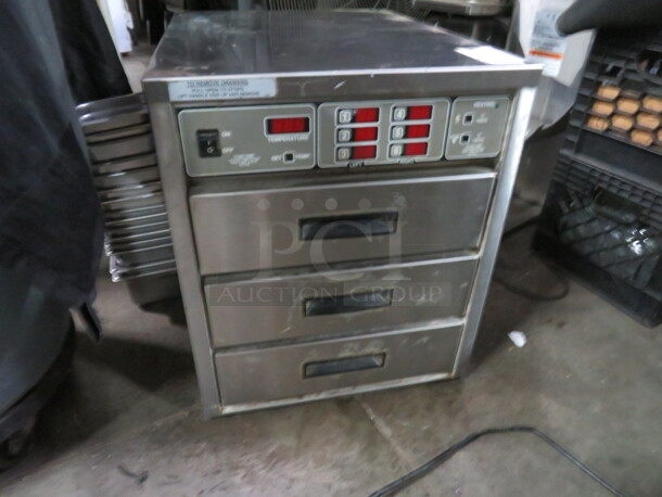 One Henny Penny 3 Drawer Warmer. Model# HC-934. 240 Volt. 18X24X22. Working When Removed.