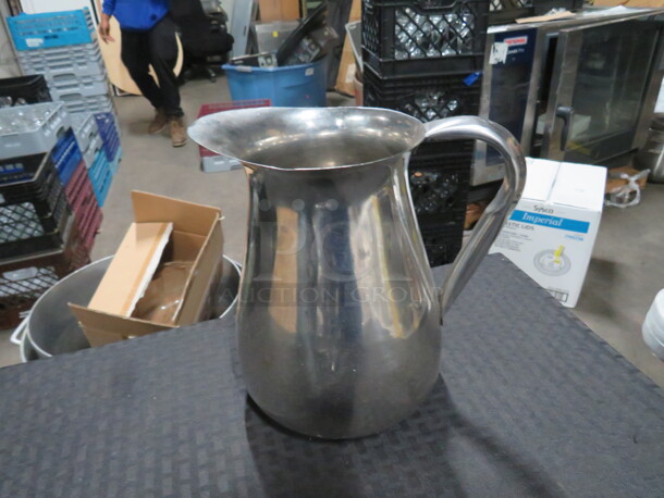 One Stainless Steel Pitcher.
