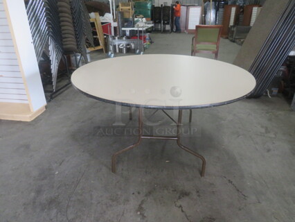One 60 Inch Round Laminate Folding Table. 60X60X29