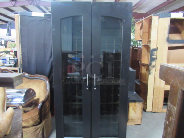 One BEAUTIFUL 2 Door Wooden/Glass Wine Cellar With Lock. This Unit Will Hold 128 Bottles. 39X29X81.5