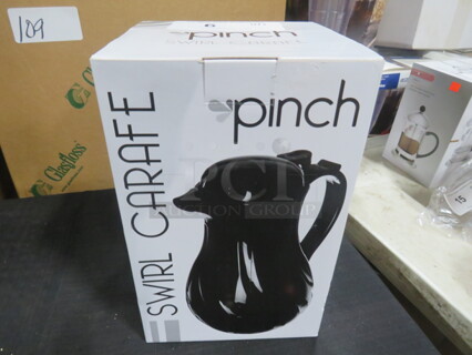 One NEW Swirl Carafe.