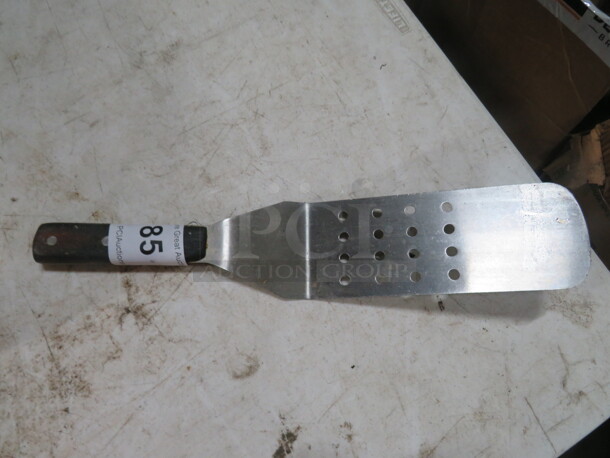 One Perforated Hamburger Turner.  - Image 1 of 1