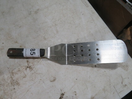 One Perforated Hamburger Turner. 