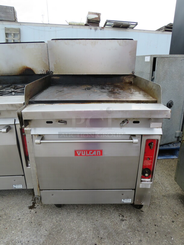 One WORKING Vulcan Natural Gas Griddle Range On Casters. 34X39X54