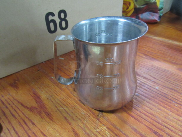 One 32oz Stainless Steel Measure Cup.