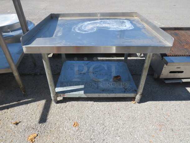 One Stainless Steel Equipment Table With Under Shelf. 36X30X25