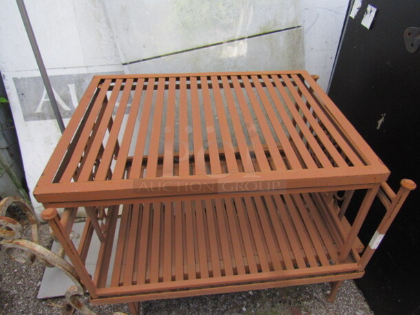 One Brown Metal Side Table/Plant Stand. 24X18X11.5
