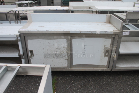 BRAND NEW SCRATCH AND DENT! Stainless Steel Commercial Table w/ 2 Doors, Back Splash and Under Shelf.