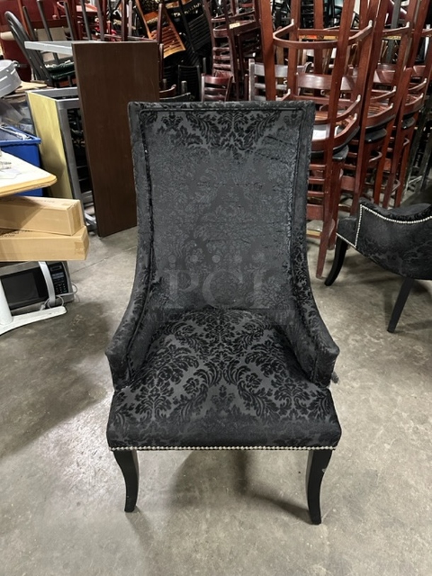 One Black Cushioned High Back Chair With Nail Head Trim