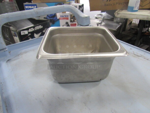 One 1/6 Size 4 Inch Deep Hotel Pan. 
